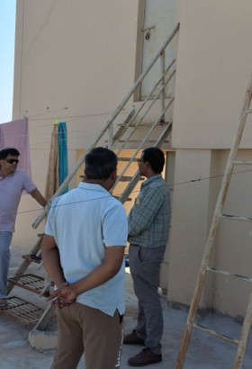 Photo of severely damaged beam/slab with exposed rusted reinforcement